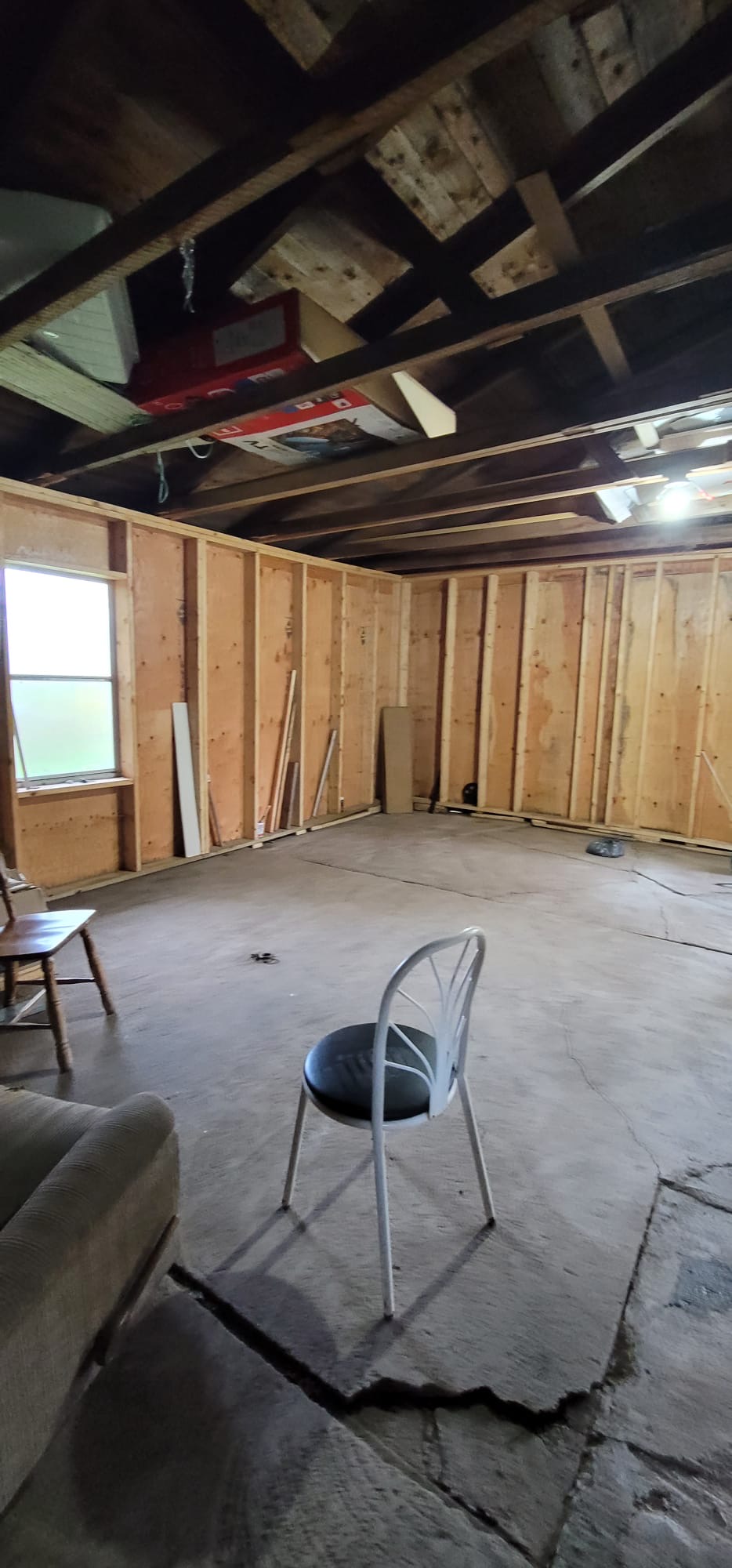 Stripped-back studs to finished, painted room — before, Kitchener
